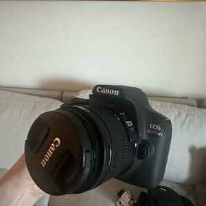 Canon DSLR Camera in Black with Attached Lens